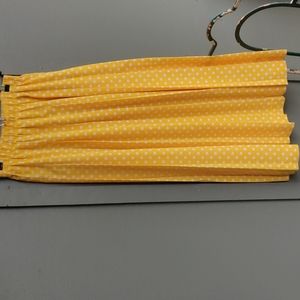 Yellow skirt with white polka dots